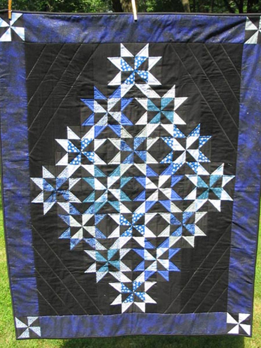 A custom quilt in a geometric design adds a burst of color and style