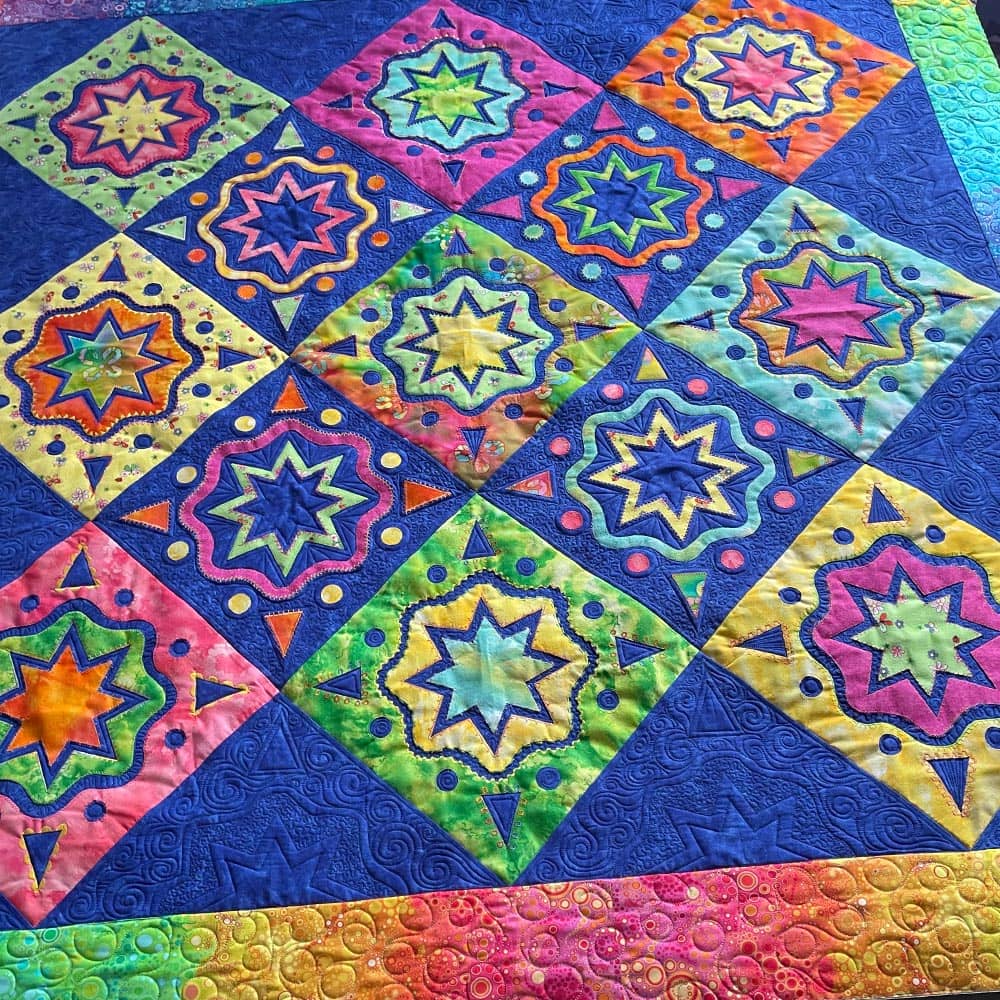 Accenting geometric shapes on a rainbow quilt
