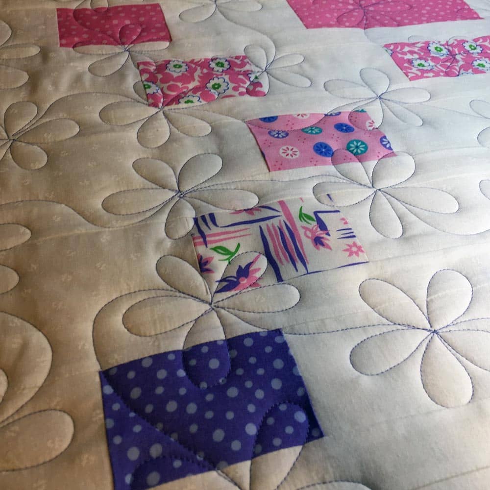 a Daisy Meander is a simple but elegant addition to a quilt